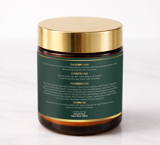 ORAVÉL Radiance Cream tone correcting cream in amber jar with gold lid on white marble surface