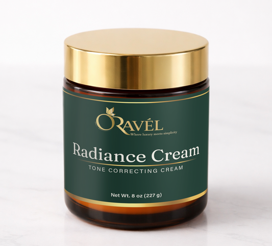 ORAVÉL Radiance Cream tone correcting cream in amber jar with gold lid on white marble surface