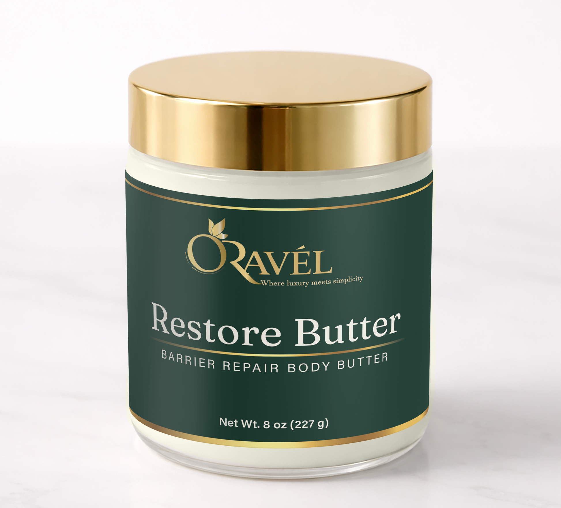 ORAVÉL Restore Butter barrier repair body butter in clear jar with brushed gold lid